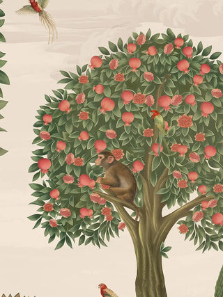 A close-up of the Rajasi Van wall art showing a monkey and a red-headed parrot among ripe and split pomegranates.