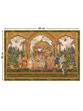 Full view of the Ram Abhishek embroidered wall art under golden scalloped arches in a flowering garden, shown at 60 cm by 90 cm.
