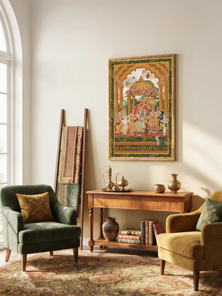 Ram Abhishek framed embroidered print providing a palatial cultural focal point above a wooden console table in a lounge area.