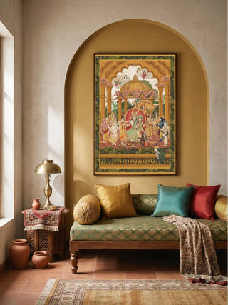 The Ram Abhishek embroidered art styled inside a grand gold frame within a traditional Indian living room alcove arch.
