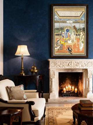 Framed Ram Darbar embroidered wall art above a marble fireplace in a navy blue living room