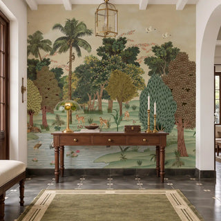 Ran Shringar wallpaper in Creamish Beige covering the wall behind a wooden console table with brass candlesticks in an entryway.