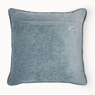 Back view of the cushion cover showing the solid navy velvet backing and zipper.