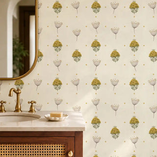 The Reva mustard sage wallpaper installed above a marble vanity with brass fixtures and a gold-framed mirror in a powder room view-powder