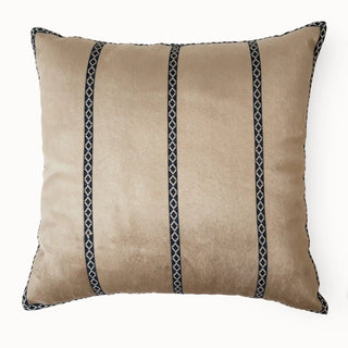 Full studio view of the Riviera Band Cushion Cover with vertical navy patterned bands on beige velvet.