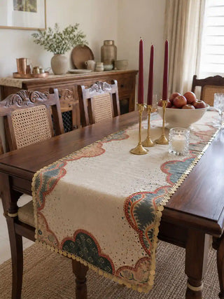 The complete Riwaayat table runner and Mehrab placemats set styled together on a luxury wooden tablescape with fine crystal and porcelain dinnerware.