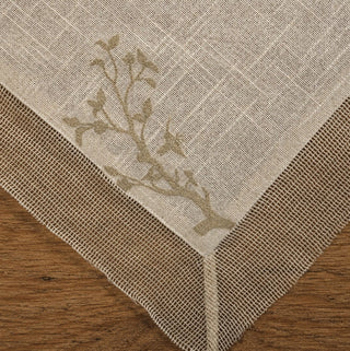 A detailed macro view of the thick, heavy-set natural jute tassel and braided edge piping on the Rooted Grace linens.