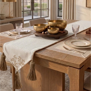 The Rooted Grace rectangular placemat styled on a cream marble dining table with fine glassware and fluted porcelain.