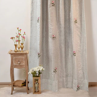 Full view of Roselene Curtain in soft grey zigzag pattern with delicate pink floral embroidery.
