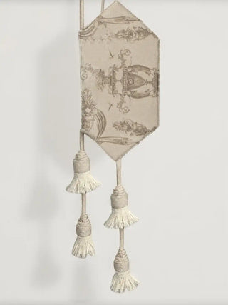 A detailed vertical close-up highlighting the multi-tiered hanging tassels and detailed thread work of the Rosette Royale curtain tieback.