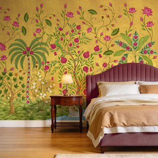 The Royal Bagh ochre mural styled in a luxury bedroom behind a plum-colored velvet headboard.