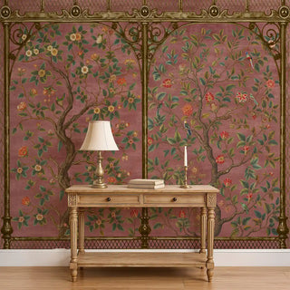 A room view of the Royal Garden Chinoiserie Wallpaper in dusty pink, showing the repeating botanical design with intricate trees and blossoms.