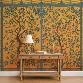 A wall view of the Royal Garden Chinoiserie Wallpaper in yellow, showing its repeating botanical and floral design framed with intricate detailing.