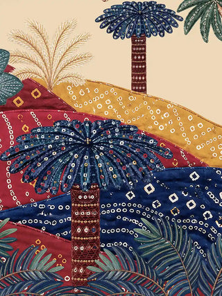 Close-up detail of The Royal Jungle Safari wall art showing indigo bandhani tie-dye patterned landscape hills and blue chain-stitch dotwork palm trees with gold bead trunk detailing on a warm parchment ground
