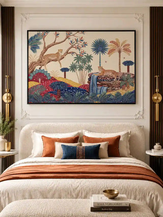 The Royal Jungle Safari wall art in a black float frame above a white upholstered bed with terracotta, navy and ivory cushions, gold cylindrical wall sconces, and dark walnut slatted panel walls in a luxury bedroom