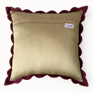 Back view of the cushion cover showing the tan satin backing and scalloped maroon border.