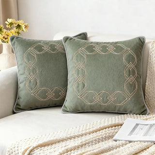 Lifestyle shot of the Ruhana cushion cover styled on a white sofa, adding an elegant touch to a modern living room decor
