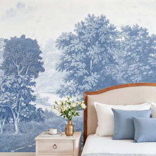 Bedroom with a nature-themed wall mural featuring trees and a landscape.