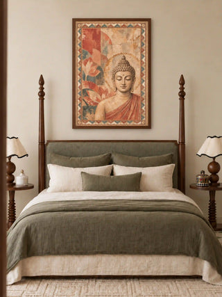 Sacred Stillness wall art in a dark wood frame above a four-poster bed with sage green linen bedding and cream scalloped lamps in a bedroom