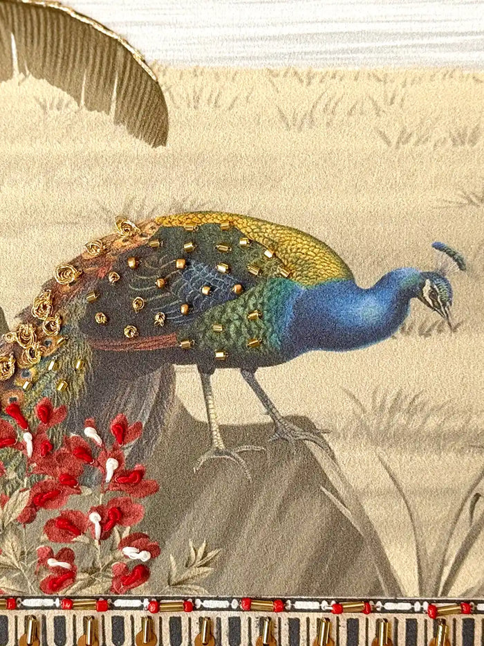 Close-up of Safar embroidery peacock motif showing sequins and thread detailing placed by hand