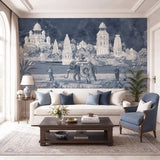 The Safar landscape mural styled as a focal backdrop in a formal living room with traditional blue accent furniture view-livingroom