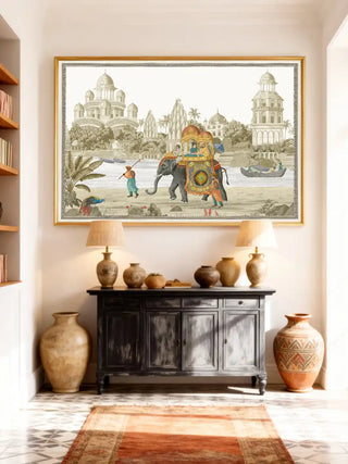 The Safar wall art in a gold frame styled above a dark wood sideboard with brass lamps in a bright luxury foyer.