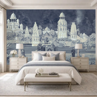 Safar vintage Indian palace wallpaper in navy and cream depicting ornate domed architecture, ceremonial elephants, and tropical gardens in a serene master bedroom with cream bedding.