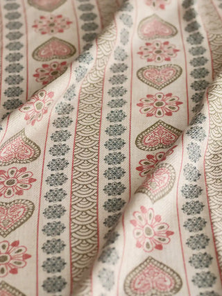A draped view of the Sarangi ivory textile showing the soft texture and rhythmic vertical heritage pattern.
