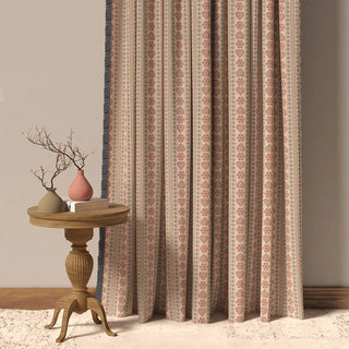 The Sarangi Fringes curtain, showcasing its vertical patterned stripes in muted pink, beige, and gray with a distinct fringed edge.