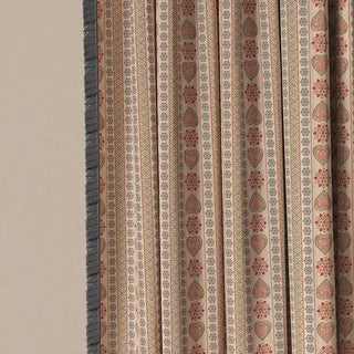 A detailed shot of the Sarangi Fringes curtain fabric, showing the unique blend of geometric and folk-inspired motifs.
