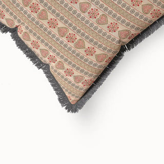 A close-up of the Sarangi Fringes cushion cover, highlighting the mix of geometric and floral-inspired patterns, and the dark fringe detail.