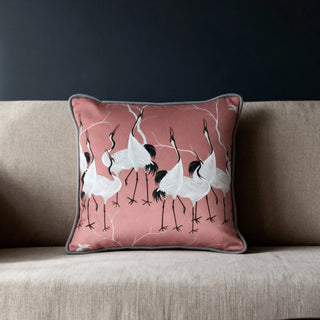 Single Sedge Cushion displayed on a beige sofa against a dark wall.