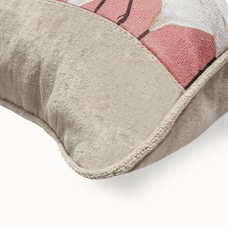 Close-up of the Sedge Poised Cranes Cushion corner showing the pink print and grey piping.
