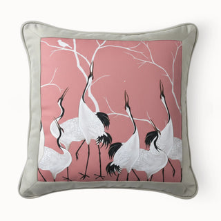 Full studio view of the Sedge Serene Cranes Cushion with beige border and pink center.