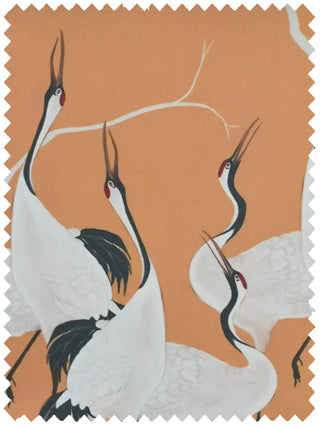 A high-resolution swatch of Sedge fabric featuring hand-painted white cranes on a warm yellow-ochre ground with ivory branches.