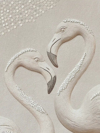 Close up detail showing the stitching and sequins used to create the flying bird motif on fabric.