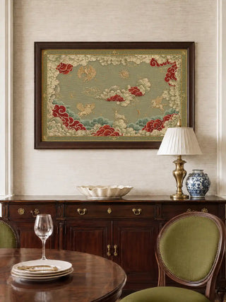 Framed Seraphim wall art in sage green hanging above a dark wood sideboard beside a round dining table with olive upholstered chairs in a formal dining room