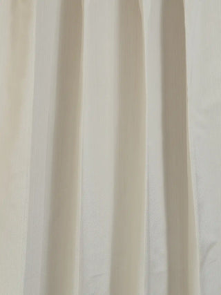 A close-up showing the premium slubbed texture of the ivory raw linen fabric used in the Serene Strokes collection.