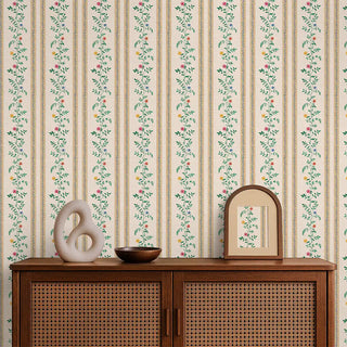 Yellow floral stripe wallpaper styled behind a wooden console with modern décor, creating a fresh and inviting look.
