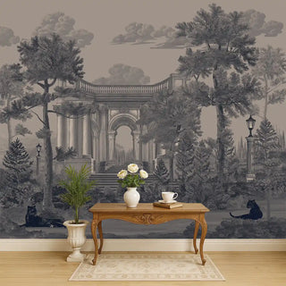 A navy and grey vintage wallpaper featuring classical arches, tall palm trees, and black panthers, styled behind a wooden console with floral decor.