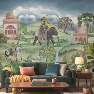 A luxury living room featuring the Shaan wall mural behind a forest green velvet sofa with amber and peach accents view-livingroom