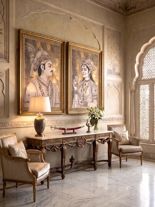 Shahenshah-e-Riyasat wall art paired with a companion portrait above a carved marble-top console with a table lamp and lilies in a marble living room