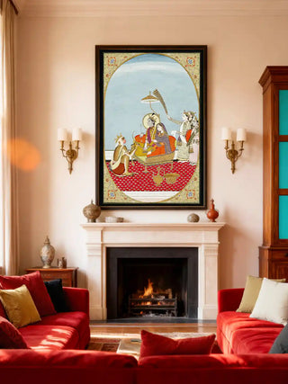 The Shiv Parivar wall art in a black frame styled above a white marble fireplace in a luxury red and gold living room.