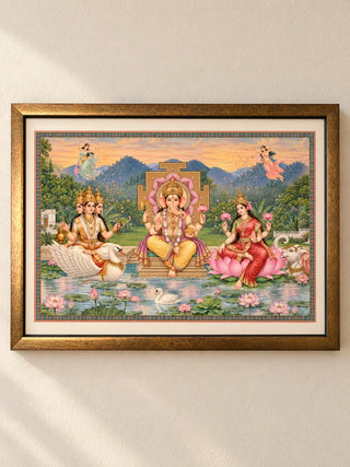 Shree Lakshmi Ganesh Saraswati framed wall art: Ganesha with Lakshmi and Saraswati on a lotus lake, landscape wooden frame with ivory mount
