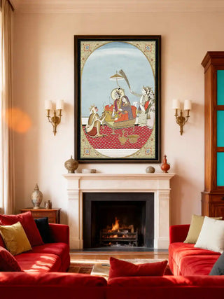 Shri Ram Parivar wall art in a black and gold frame above a limestone fireplace, flanked by brass wall sconces with red velvet sofas in a classic living room