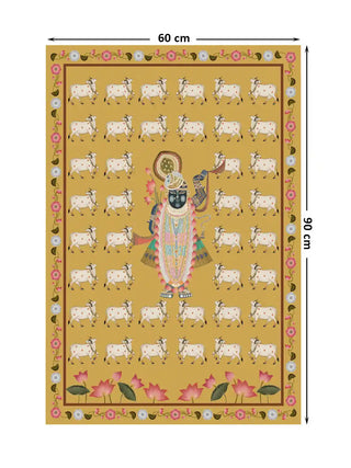 Full layout of Shrinathji Pichwai wall art at 60×90 cm showing the ornately adorned deity at centre surrounded by rows of sacred white Gir cows on a saffron gold ground with pink lotus base and floral vine border
