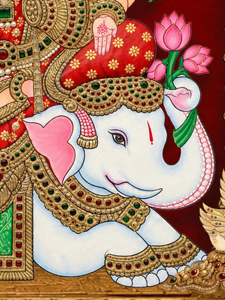 A detailed close-up of the Shriyam wall art showing the white elephant beside the Gaja Lakshmi figure, rendered in gem-set gold relief work.
