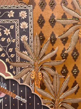Detail view of the gold embroidered palm tree and floral borders on the Shyam Sundar wall art canvas.