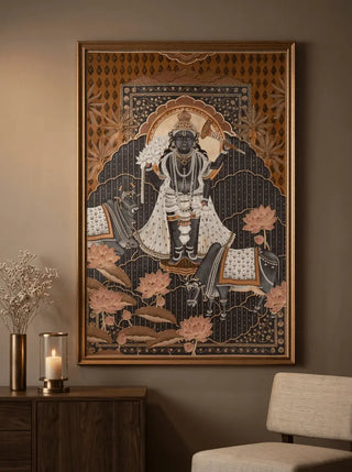 Shyam Sundar wall art of a seated Krishna figure with intricate patterns in a room with a candle and vase.