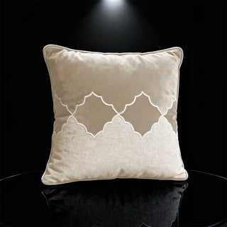 A dramatic mood shot of the Sierra Lattice cushion under a spotlight, showcasing the reflective quality of the velvet.